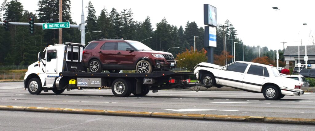 Tow truck providing battery Replacement in Willard